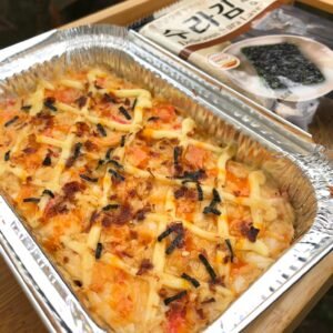 Cheesy baked sushi dish served at Kapé Lélangan